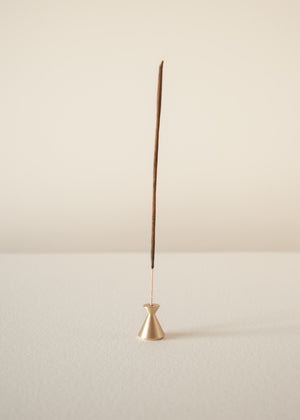 Incense stick on a beige background