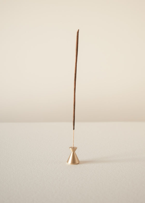 Incense stick on a beige background