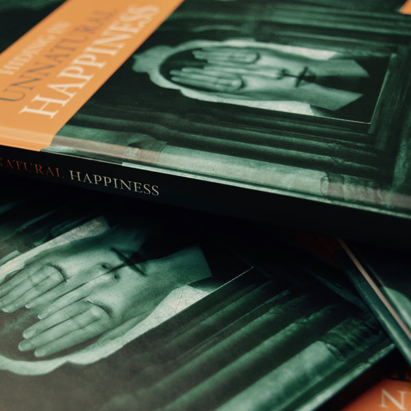 HIDING IN UNNATURAL HAPPINESS